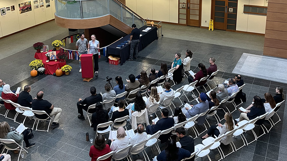 Two students announcing award winners to the audience at Stritch Faculty and Staff Awards 2025
